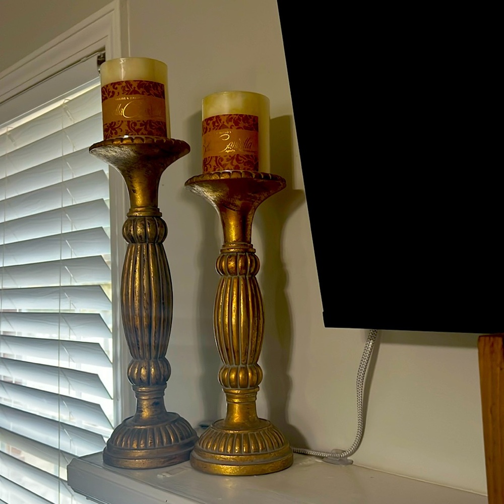 Gold candleholders with candles